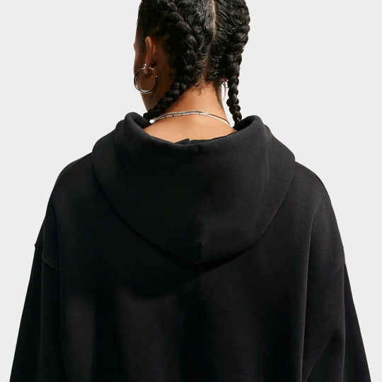 Nike Studio Fleece Cropped Full Zip Hoodie. Back view of black cropped hoodie showing the hood, dropped shoulders and relaxed silhouette.