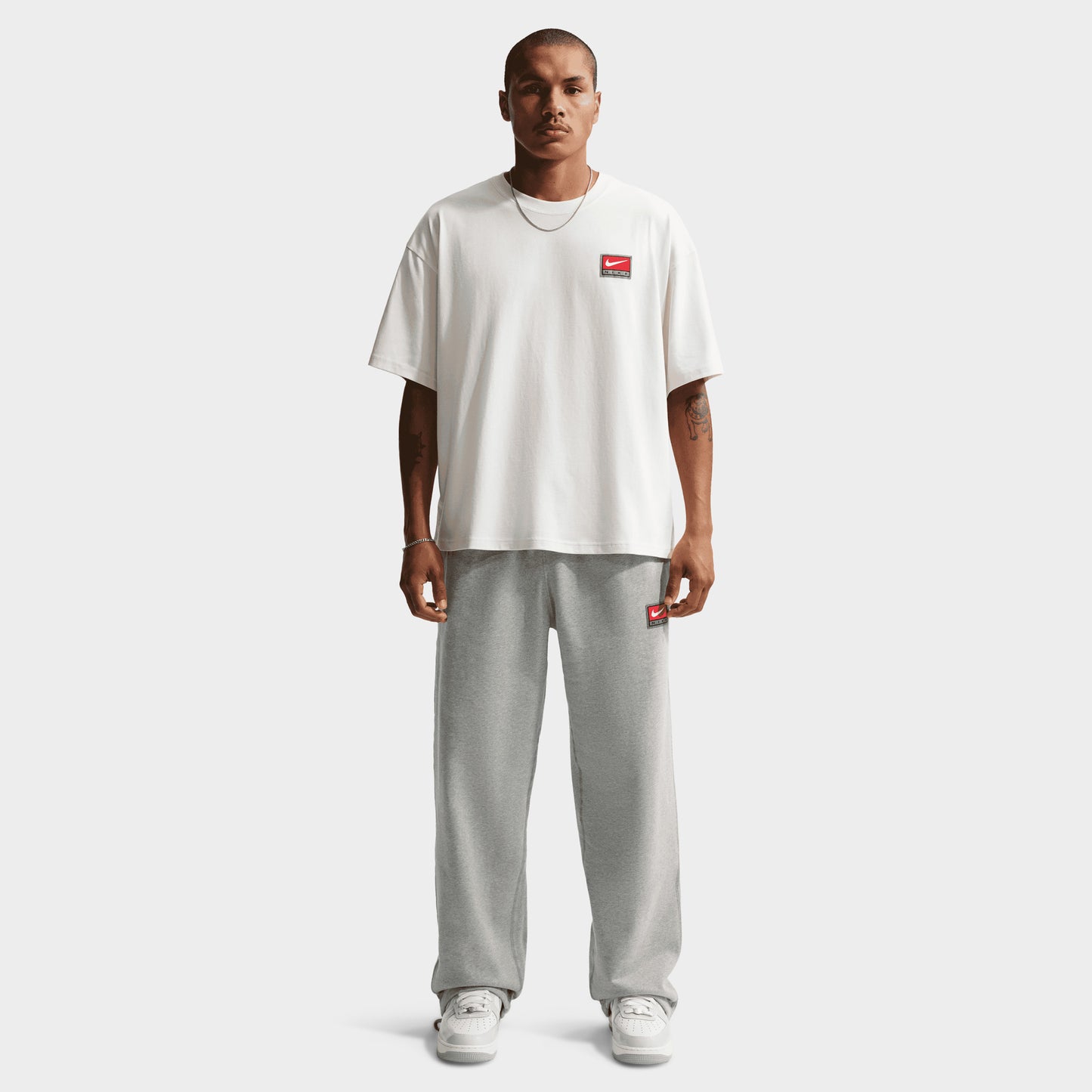 Nike Solo Swoosh Pantalon Polaire à ourlet ouvert / Gris Chiné