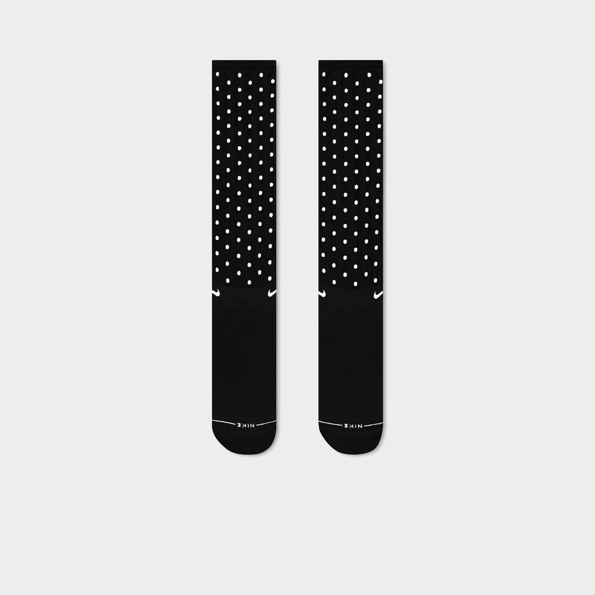 Nike Elevated Sheer Socks (1-Pair). Front view of football grey sheer crew socks with dotted pattern and solid toe and heel sections.