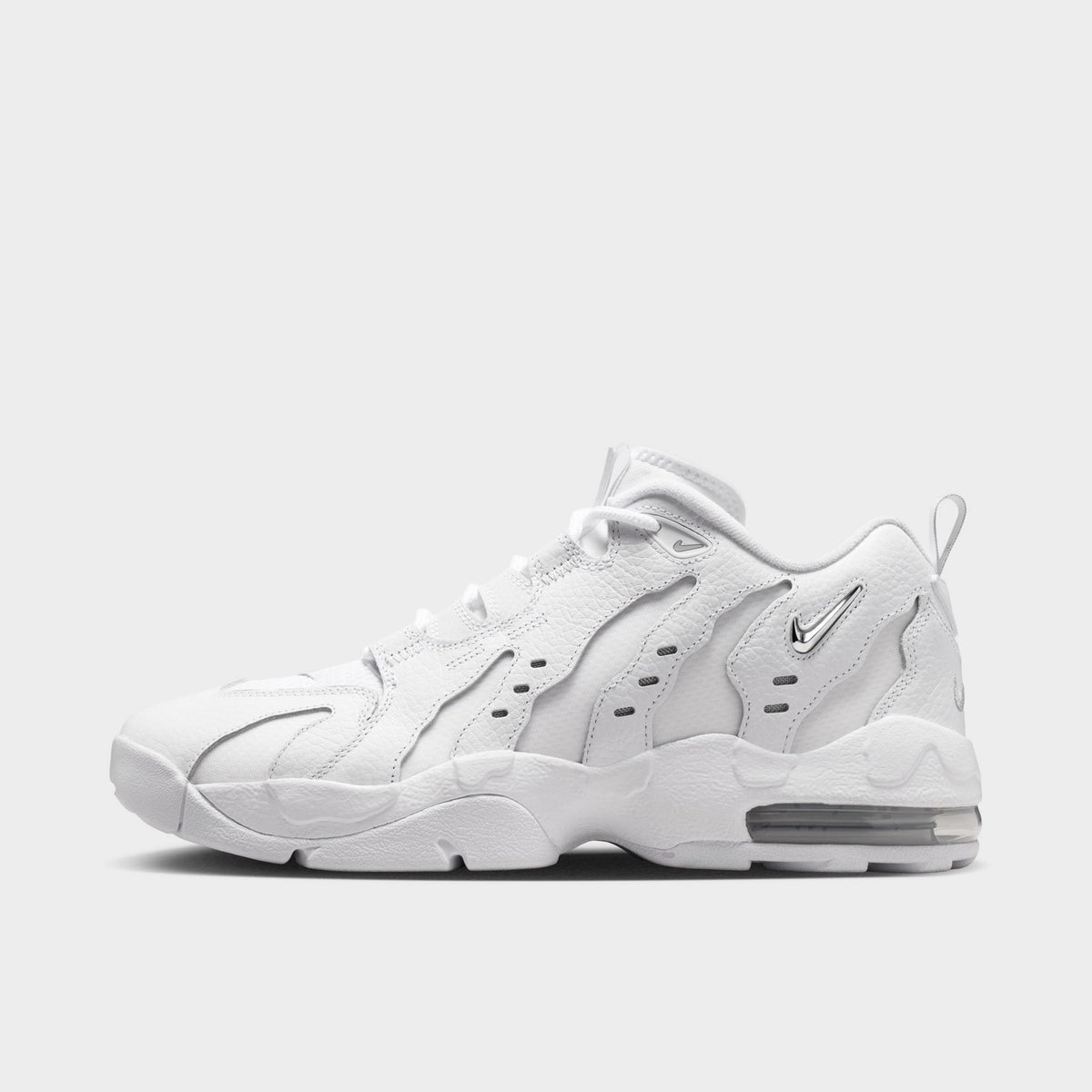 Nike Air DT Max '96 Low. Side view of white and metallic silver sneaker with sculpted overlays, perforated panels and visible Air cushioning.
