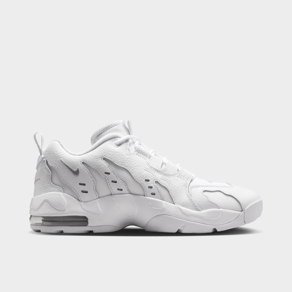Nike Air DT Max '96 Low. Opposite side view of white and metallic silver sneaker with angular overlays, perforated panels and sculpted sole.
