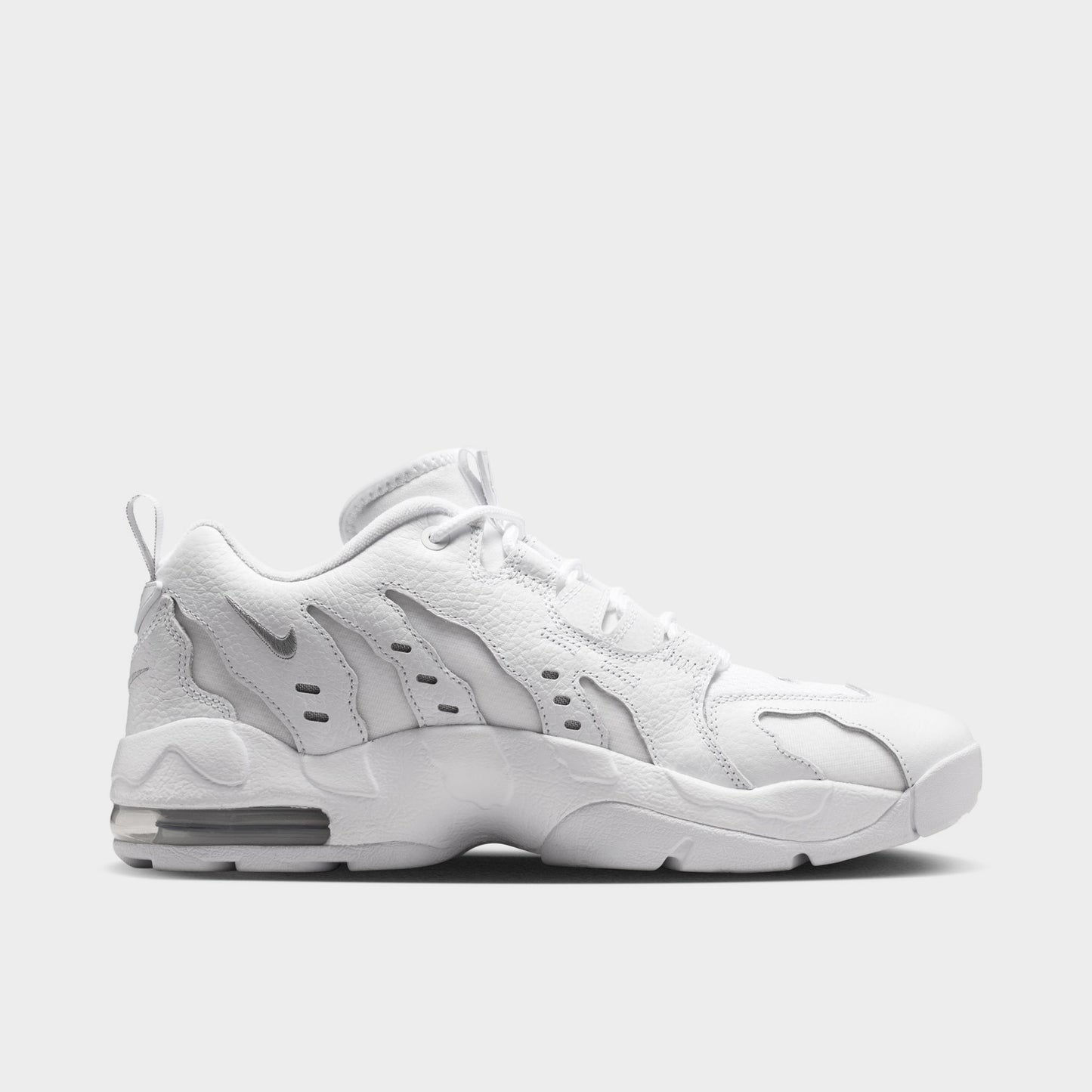 Nike Air DT Max '96 Low. Opposite side view of white and metallic silver sneaker with angular overlays, perforated panels and sculpted sole.