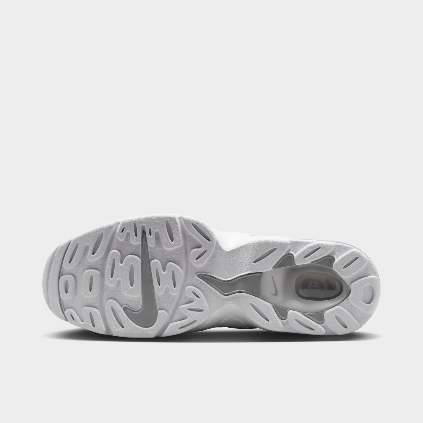 Nike Air DT Max '96 Low. Bottom view of white and metallic silver sneaker showing grey and white segmented outsole with textured tread pattern.