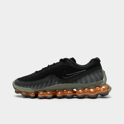 Nike Air Liquid Max. Side view of black, metallic silver and light army sneaker with wavy upper lines, tonal Swoosh and amber full-length Air sole.