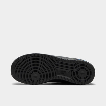 Nike Air Force 1 GS. Bottom view of single shoe displaying full anthracite rubber outsole with classic Air Force 1 concentric circle tread pattern. 