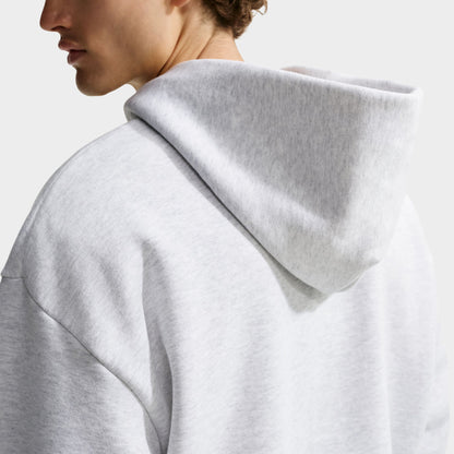 Nike Solo Fleece Full-Zip Hoodie. Close-up rear neck view showing spacious fleece hood structure, soft heather texture, and shoulder seam alignment. 