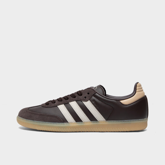 adidas Samba. Side view of aurora coffee, core white and magic beige sneaker with white three stripes, dark brown upper and gum sole.