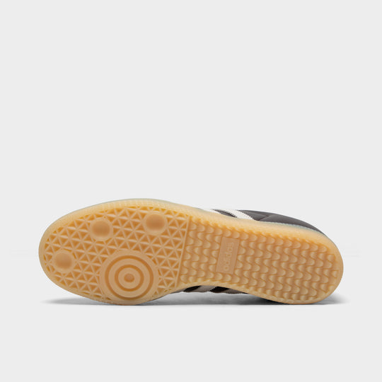 adidas Samba. Bottom view of aurora coffee, core white and magic beige sneaker showing gum outsole with textured tread pattern.