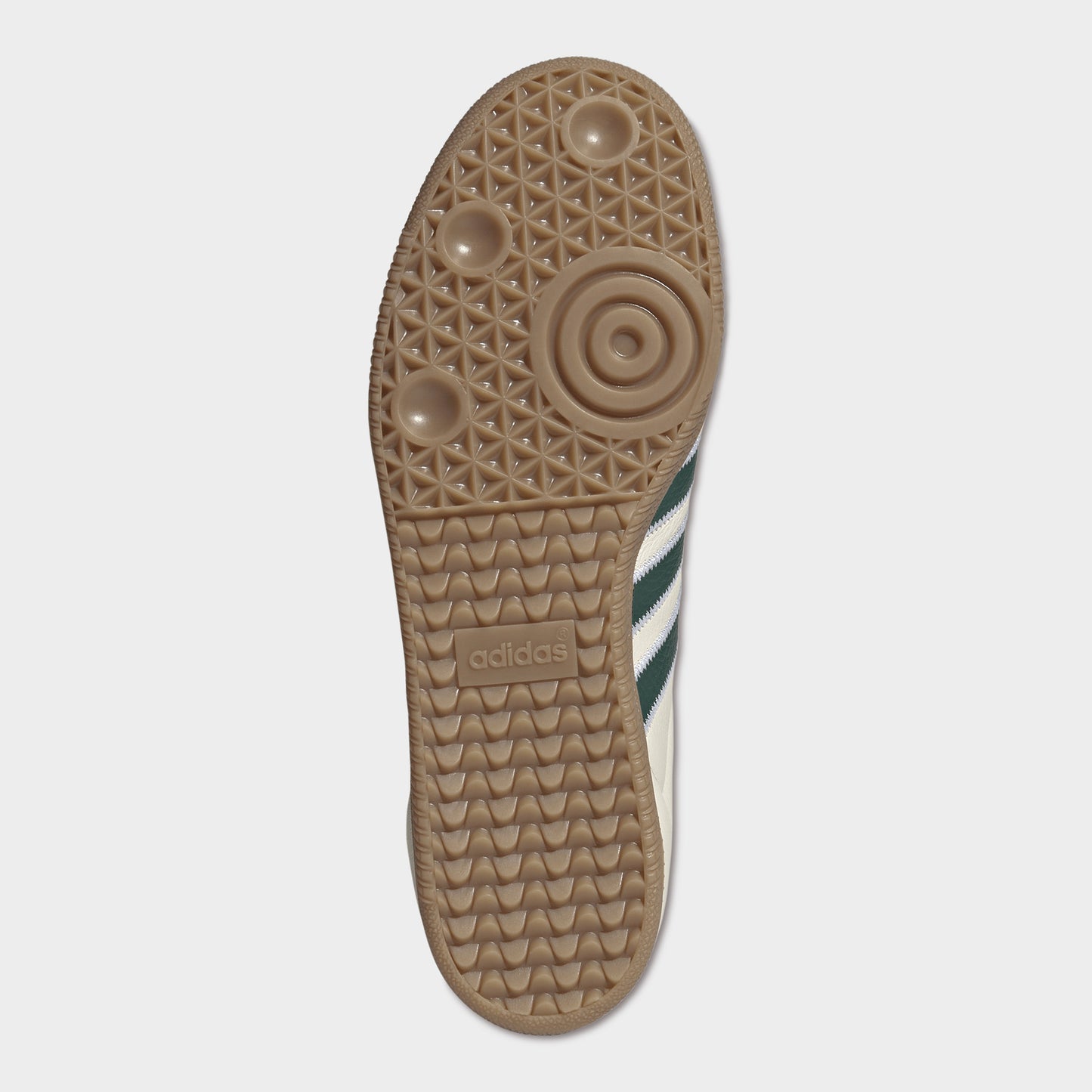 adidas Samba OG. Bottom view of cream, collegiate green and gum sneaker showing brown gum outsole with circular forefoot tread.