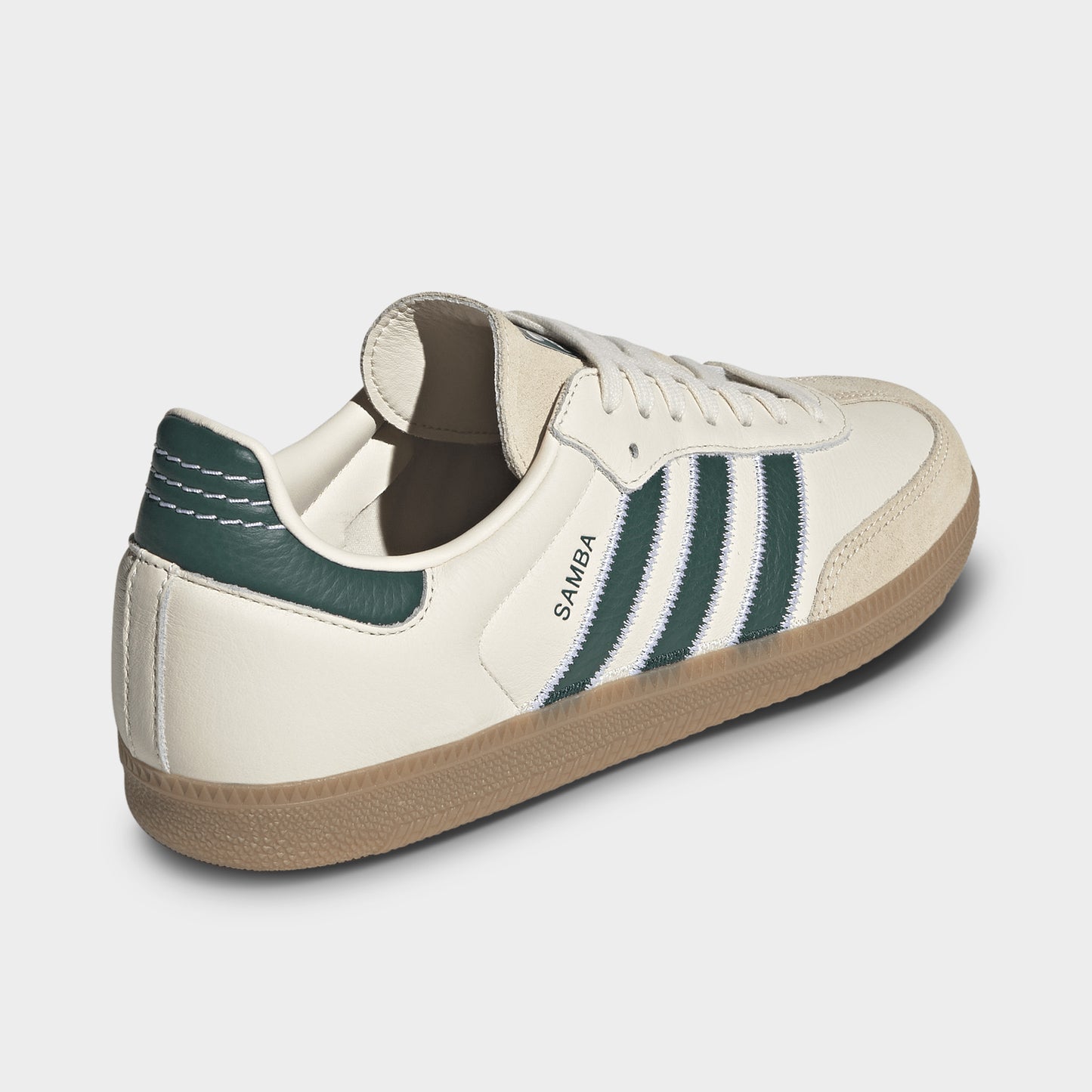 adidas Samba OG. Rear three-quarter view of cream, collegiate green and gum sneaker with green heel tab, padded collar and gum sole.
