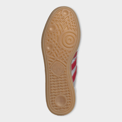 adidas Handball Spezial. Bottom view of halo silver, team victory red and gum sneaker showing brown gum outsole with circular forefoot tread.
