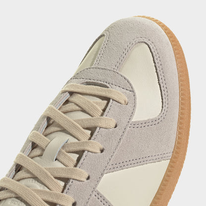 adidas BW Army. Close-up of chalk white, clear granite and gum sneaker showing beige laces, tonal three stripes and stitched toe panel.