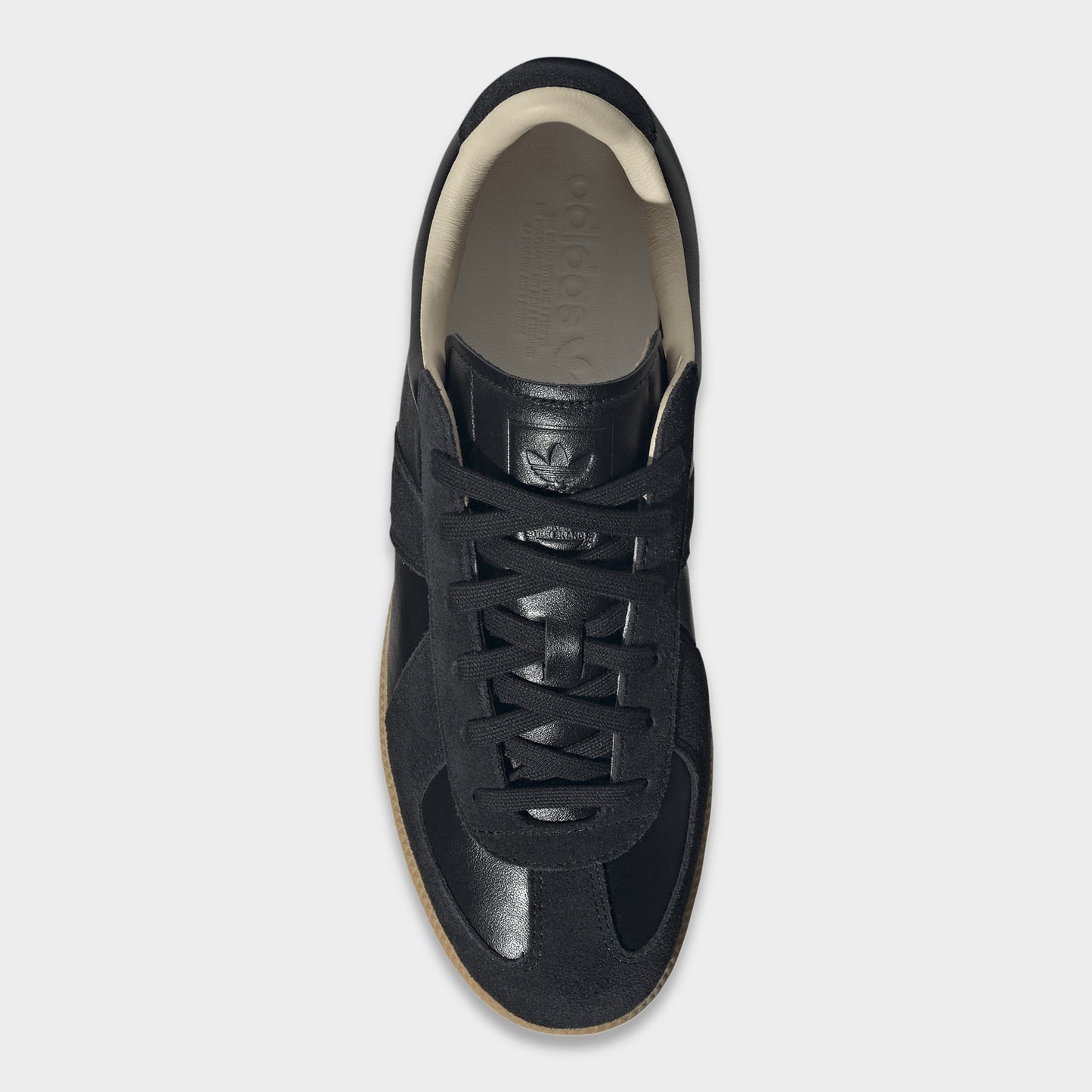 adidas BW Army. Top view of black and gum sneaker showing black laces, padded tongue and cream-coloured lining.