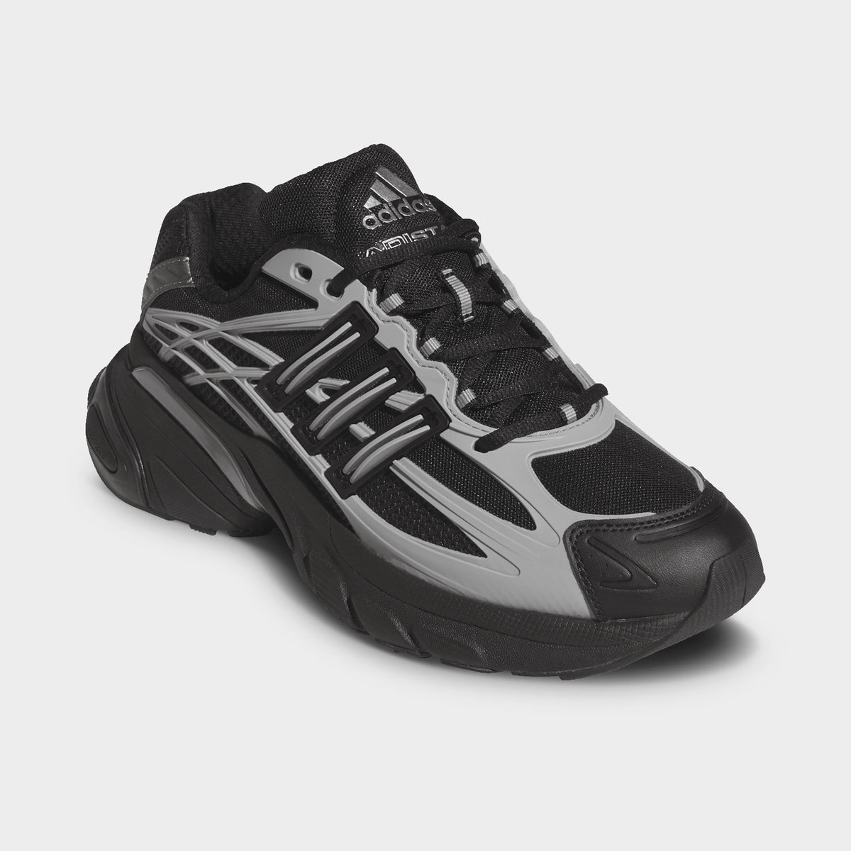 adidas Adistar XLG 2.0. Three-quarter view of core black and iron metallic sneakers with black laces, angular overlays and chunky soles.