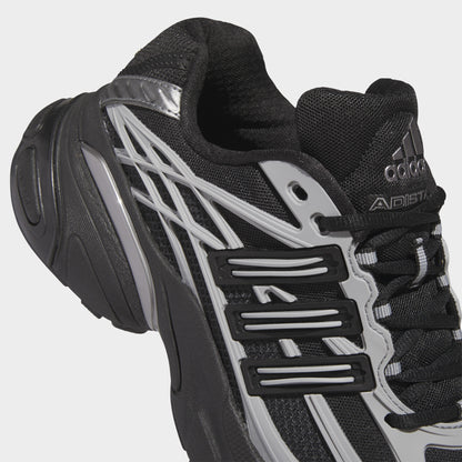 adidas Adistar XLG 2.0. Close-up of core black and iron metallic sneaker showing black laces, mesh panels, tongue branding and metallic three stripes.