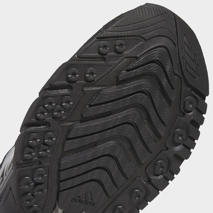 adidas Adistar XLG 2.0. Close-up of core black and iron metallic sneaker showing black outsole with curved grooves and textured tread.