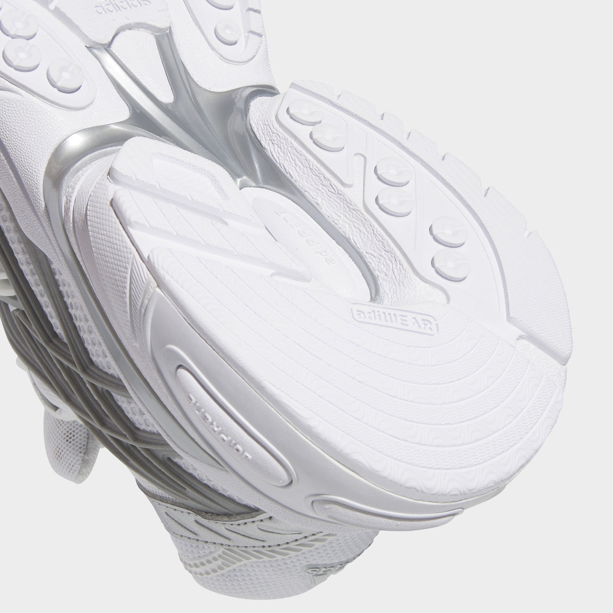 adidas Adistar XLG 2.0. Close-up of footwear white and silver metallic sneaker showing layered midsole and textured outsole.