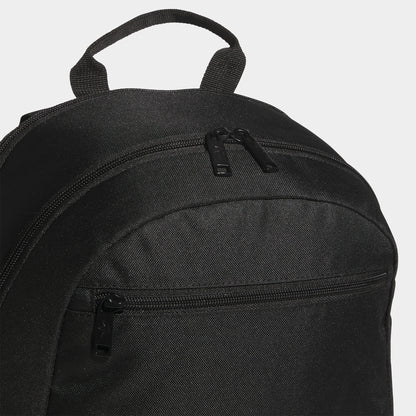adidas Premise 2.0 Backpack. Close-up of black backpack showing top carry handle, upper zip compartment and stitched panel construction.