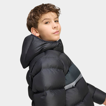adidas Juniors' Blocking Regular Puffer. Side profile view displaying the padded hood, long sleeves, black quilted shell, and grey contrast panel along the chest. 
