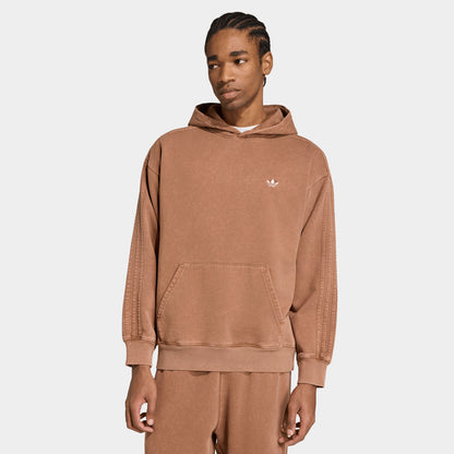 adidas Trefoil Essentials Washed Loose Hoodie. Front view of model wearing preloved brown hoodie with kangaroo pocket and small white Trefoil chest logo.