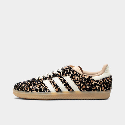 adidas Juniors' Samba OG J. Side view of sand strata, ivory and gum junior sneaker with leopard-print upper, ivory three stripes and gum sole.