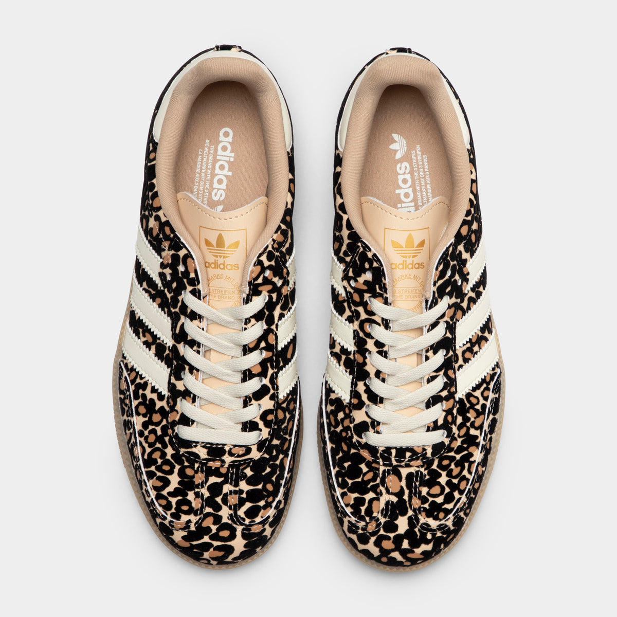 adidas Juniors' Samba OG J. Top view of sand strata, ivory and gum junior sneakers showing white laces, patterned uppers and padded collars.