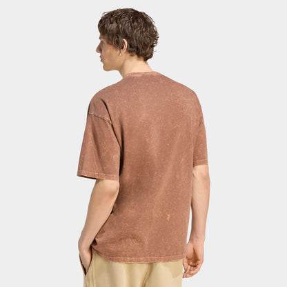adidas Trefoil Essential Washed Loose T-Shirt. Back view of model wearing preloved brown T-shirt with plain back, dropped shoulders and loose silhouette.