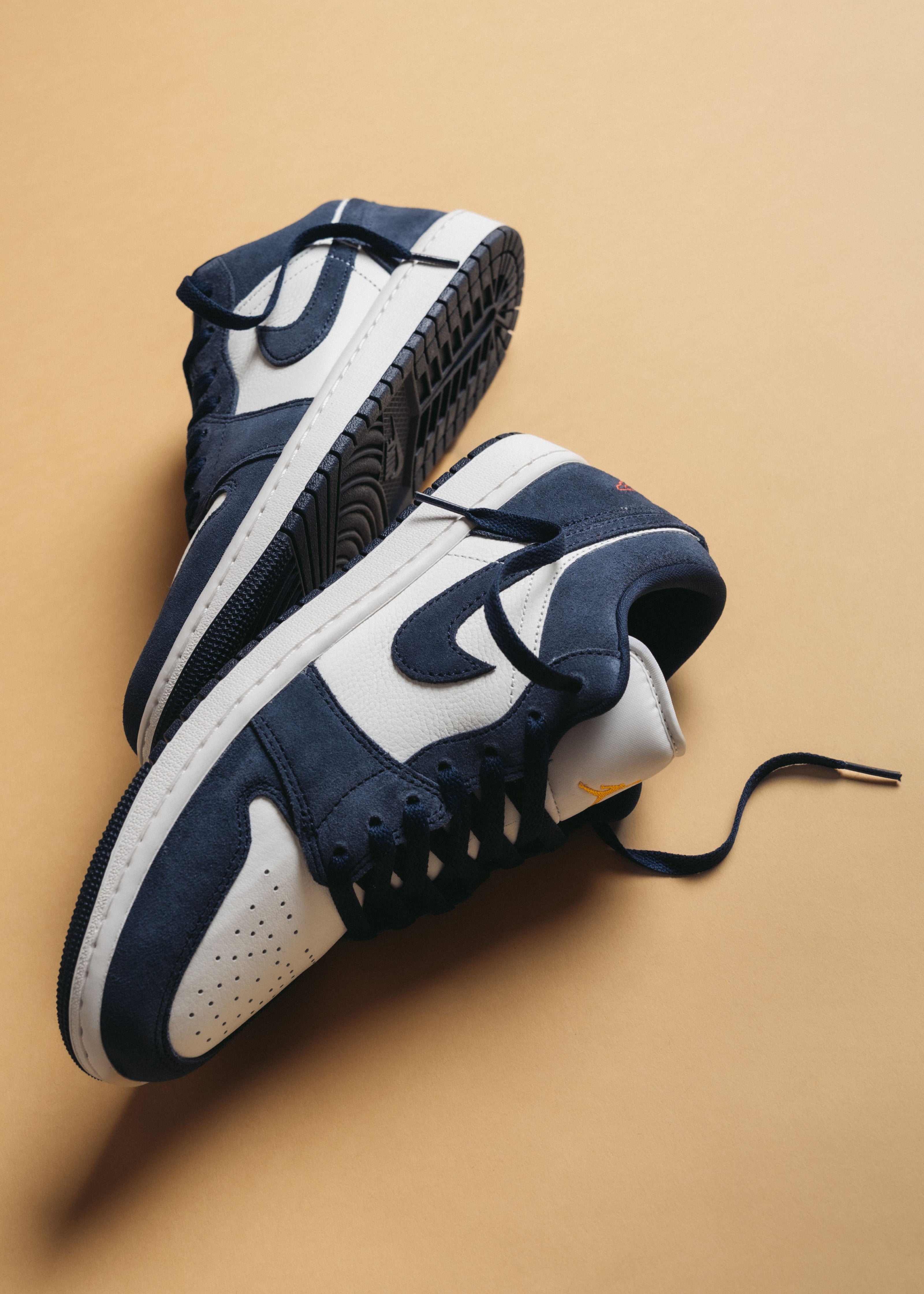 Jordan 1 Low “Obsidian / University Gold” shoe. Shop Low Profile now at JD Sports.