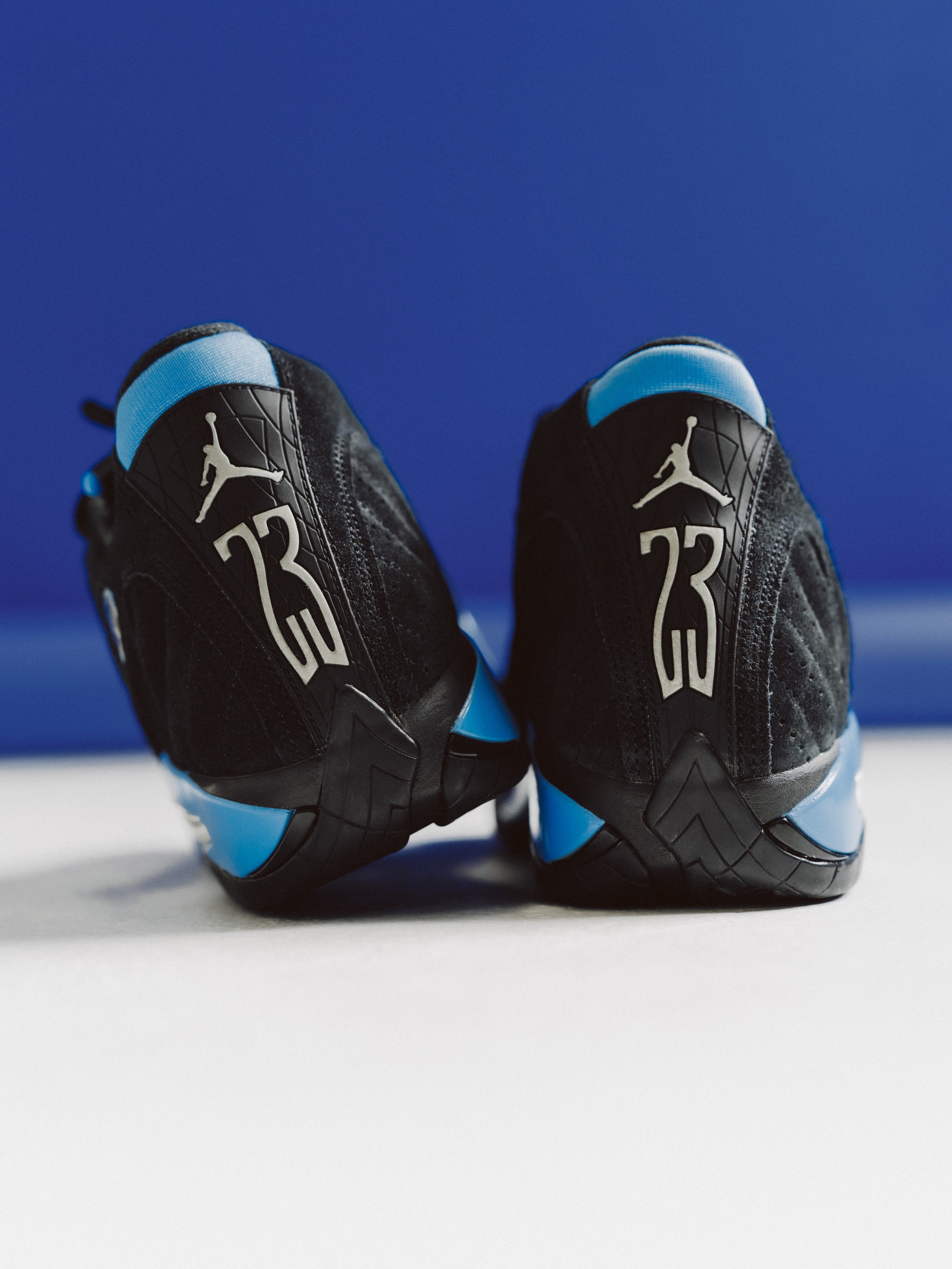Jordan 14 Retro “Black / White – University Blue” shoe. Shop New now at JD Sports.