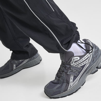 New Balance Vision Woven Track Pants Black / 3M Reflective