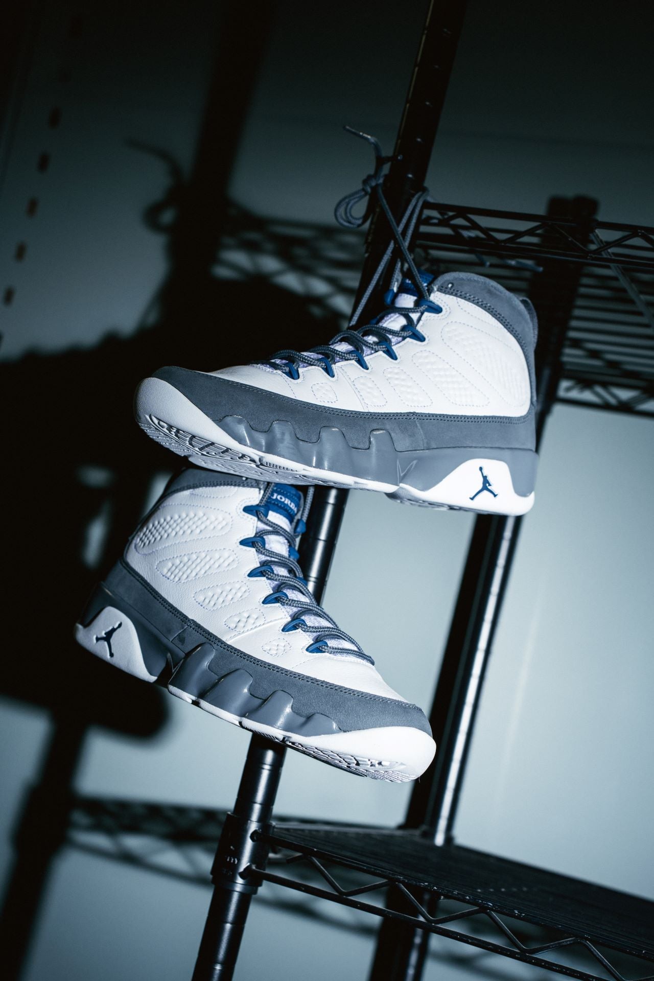 Jordan 9 Retro “White / French Blue – Flint Grey” shoe. Shop New This Week now at JD Sports.