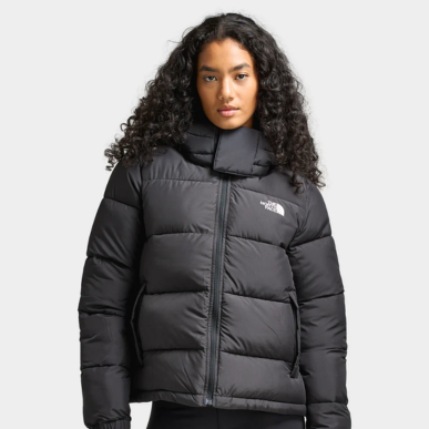 Woman wears The North Face Women's Puffy Jacket "Black". Shop Women's Clothing now.