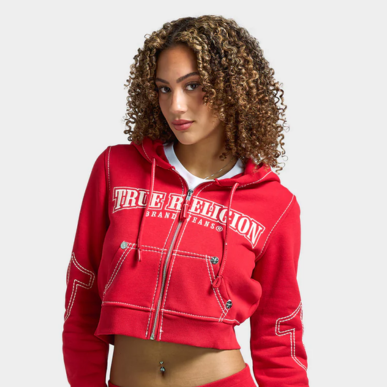 Woman wears True Religion Women's Anniversary Big T Shrunken Hoodie "Scarlet Sage". Shop Women's Clothing now.