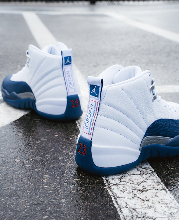 Jordan 12 Retro "White / French Blue - Metallic Silver" shoe. Shop the latest basketball styles now at JD Sports