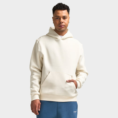 Sonneti London Hoodie 2.0. Front view of model wearing egret hoodie with kangaroo pocket, drawstring-free hood and relaxed fit.