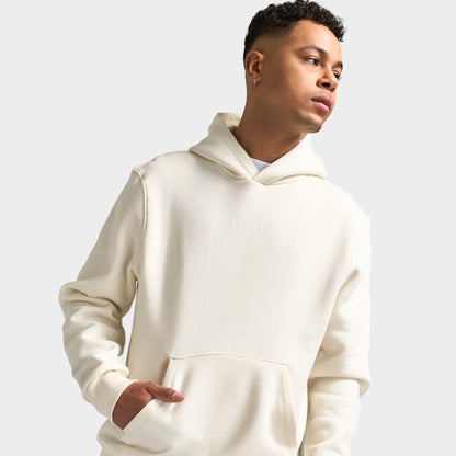Sonneti London Hoodie 2.0. Three-quarter view of model wearing egret hoodie with kangaroo pocket and relaxed sleeves.