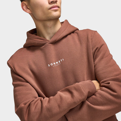 Sonneti London Hoodie 2.0. Close-up of cocoa brown hoodie showing the hood, neckline and small white Sonneti chest branding.