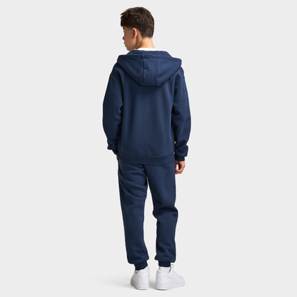Supply & Demand Juniors' Scape Hoodie. Full-body back view of model wearing washed navy hoodie with raised hood and matching pants.