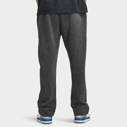 Supply & Demand Murphy Oversized Pants. Back view of model wearing black oversized pants with wide legs, relaxed fit and plain rear panels.