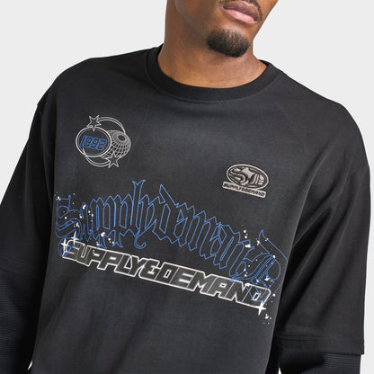 Supply & Demand Global Longsleeve Tee. Close-up of black long-sleeve T-shirt showing large blue and grey Supply & Demand graphic across the chest.
