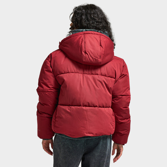 Supply & Demand Women's Macy Jacket. Back view of model wearing pomegranate puffer jacket with padded hood and quilted construction.