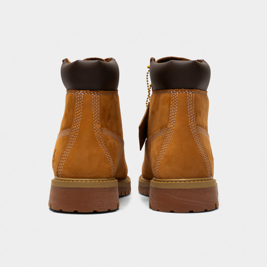 Timberland Juniors' 6" Premium Lace Up Waterproof Boot. Rear view of wheat junior boots with padded black collars, stitched heel panels and lugged soles.