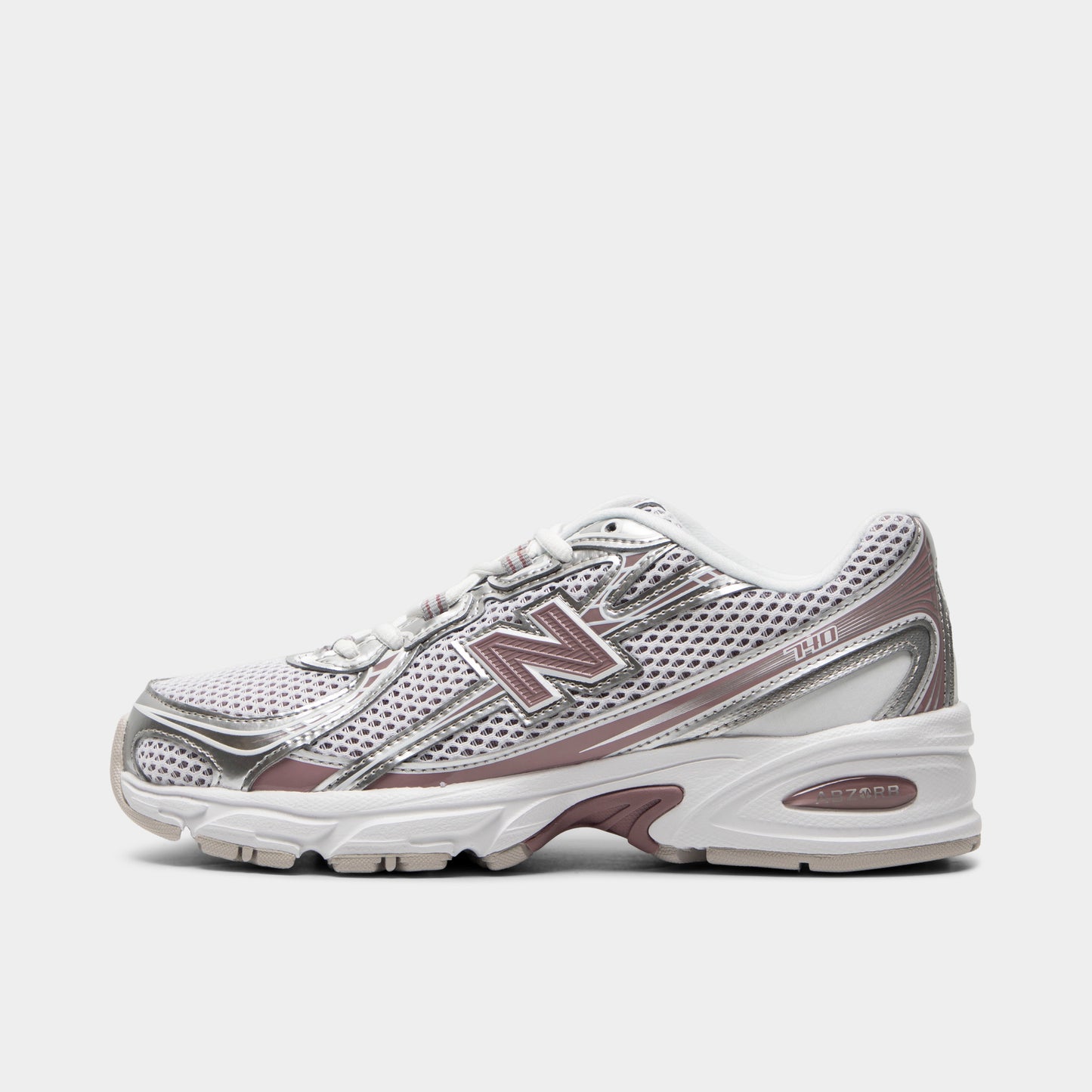 New Balance 740. Side view of silver metallic, raincloud and pebble sneaker with layered mesh panels, pink N logo and sculpted sole.