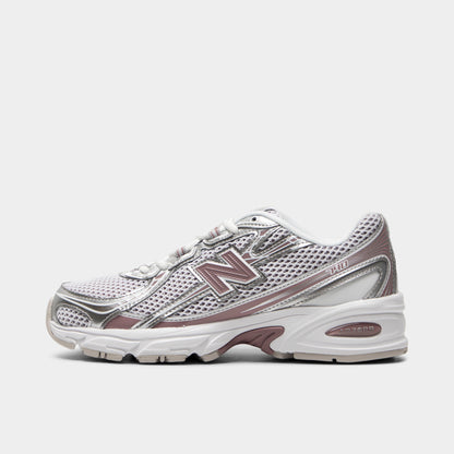 New Balance 740. Side view of silver metallic, raincloud and pebble sneaker with layered mesh panels, pink N logo and sculpted sole.