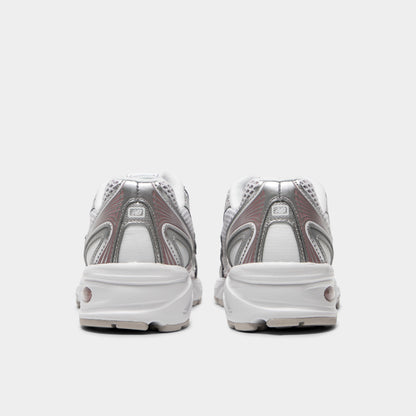 New Balance 740. Rear view of silver metallic, raincloud and pebble sneakers with padded heel panels, layered detailing and light midsoles.