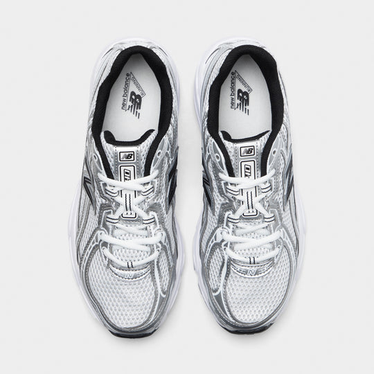 New Balance 740. Top view of white, silver metallic and black sneakers showing white laces, mesh toe boxes and black collars.