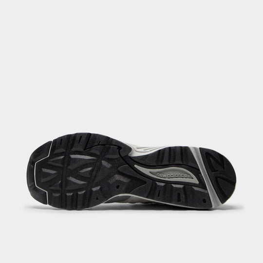 New Balance 880. Bottom view of the Sea Salt and Slate Grey sneaker showing the black rubber outsole with textured traction pattern.