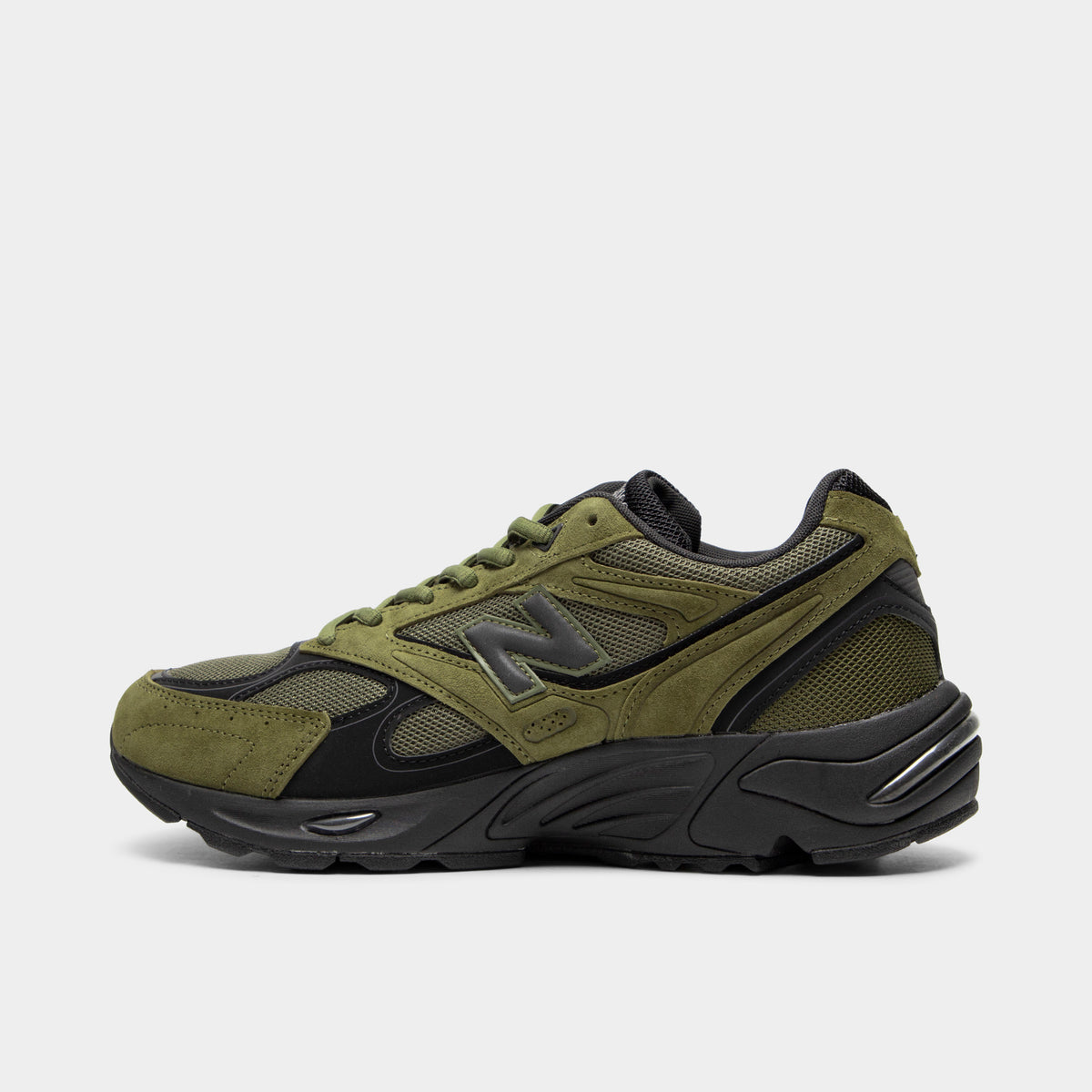 New Balance 880. Side view of low-top sneakers featuring a wakame olive green mesh upper with matching wakame green suede overlays, black leather trim, dark grey "N" logo on the midfoot, wakame green laces, black padded collar, black foam cushioned midsole, and a black rubber outsole. 
