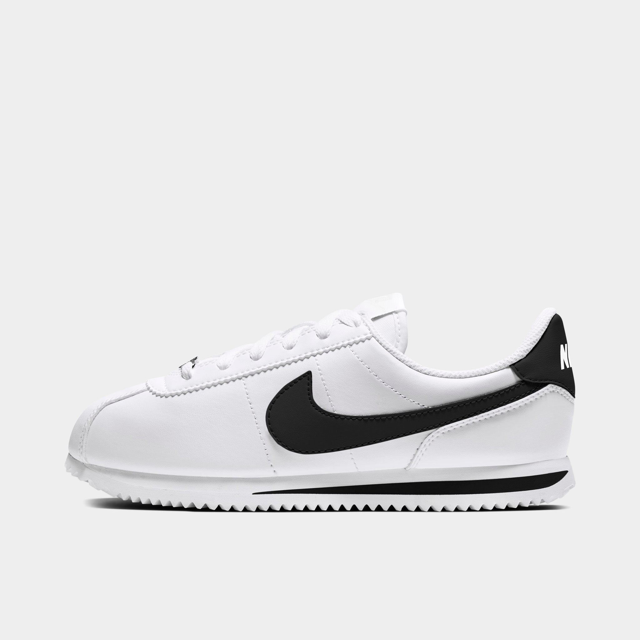 white and yellow nike cortez